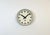 This wall clock was produced by Pragotron in former Czechoslovakia during the 1960s. It features a grey hammerpaint metal...