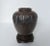 Circa 1915, Japanese bronze vase with drip design reminiscent of an overflowing jar. Beautiful patina. It is paired with...
