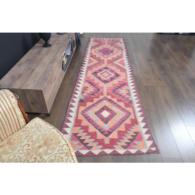 Vintage Turkish Hand-Knotted vintage rug is a semi- vintage runner rug.'70s Eastern region of Turkey's unique rug is...