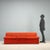 Three-seater Zanotta sofa, crafted between the 1970s and '80s. It features original brick-colored fabric upholstery,...