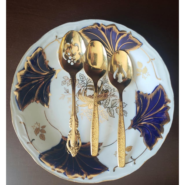 Elevate your tabletop with this collectible rich cobalt blue dinner plate from Germany. Features and deep cobalt blue...