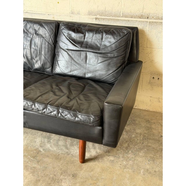 This compact loveseat features clean lines and plush cushions, delivering a sleek profile. Elevated on tapered legs, it...