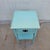 Small vintage nightstand or end table painted an antique pale blue/aqua. Solid wood construction. Inside the single drawer...
