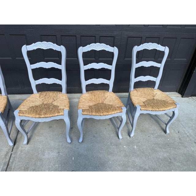 Add timeless French country charm to your dining space with this beautiful set of six solid wood ladder back dining...