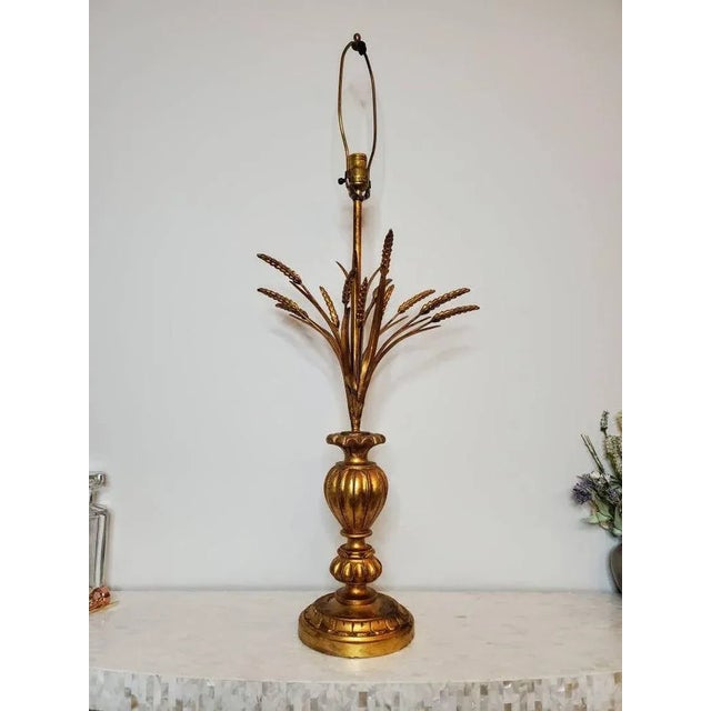 A large Mid Century Modern Hollywood Regency "Coco Chanel" style gilded ceramic wood brass and tole wheat sheaf table...