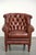 This cognac-colored cowhide Chesterfield armchair is crafted in a timeless English style and is of high quality. The...