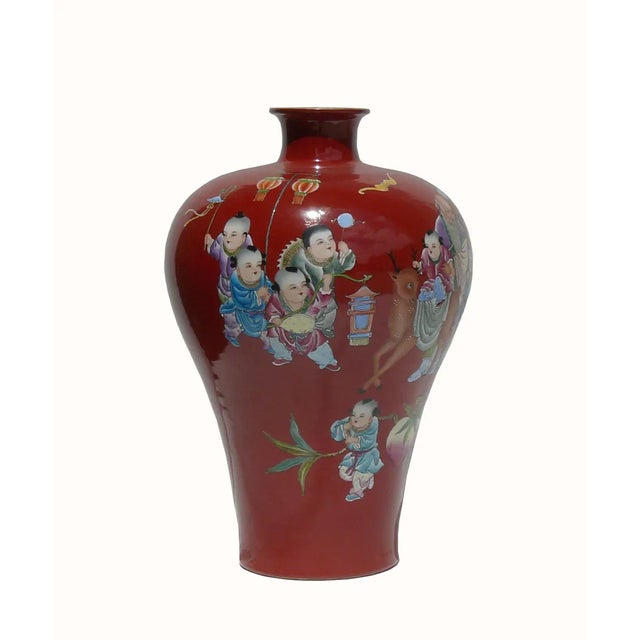 This beautiful vase is painted with a Longevity old man surrounded by many kids. Each of the kids is doing different...