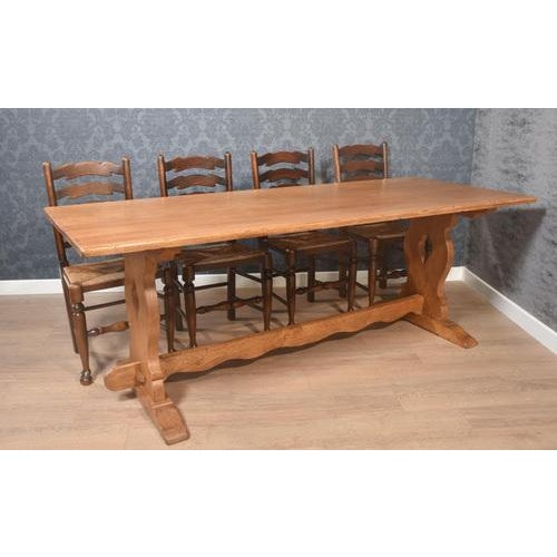 Large Oak refectory table, the plank top, raised on trestle ends united by wavey stretcher. Dimensions Height 30 Inches...