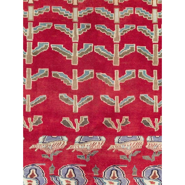 This mid-20th-century Persian Kashan carpet presents a highly distinctive pictorial and botanical composition across a...