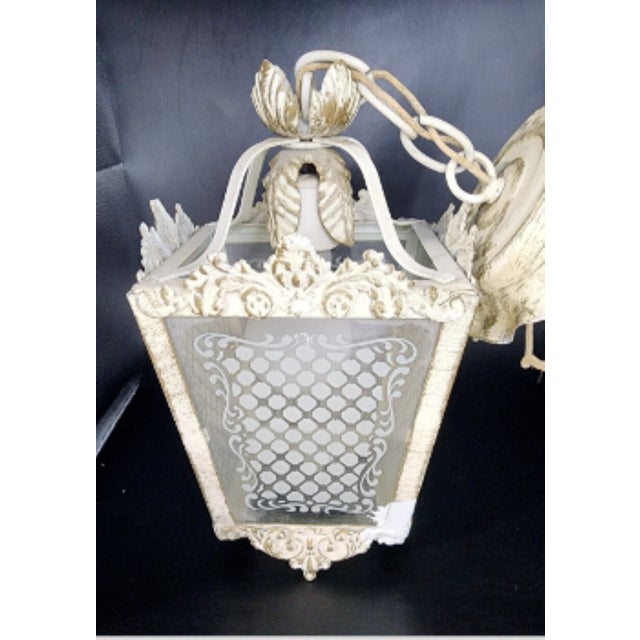 A lovely vintage light from the middle of the century. This 4-panel pendant light could work indoors or outdoors and...
