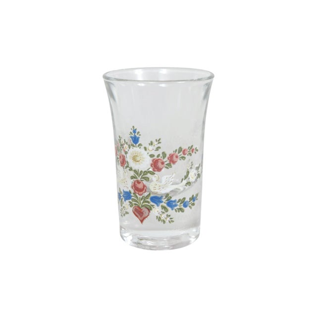 A set of four Italian shot glasses. Hand painted with red and white roses and bluebells in a floral spray. Marked ‘Italy’...