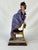 An exquisite life-like porcelain figurine created and signed by renowned artist Giuseppe Armani called “Clown on Chair”...