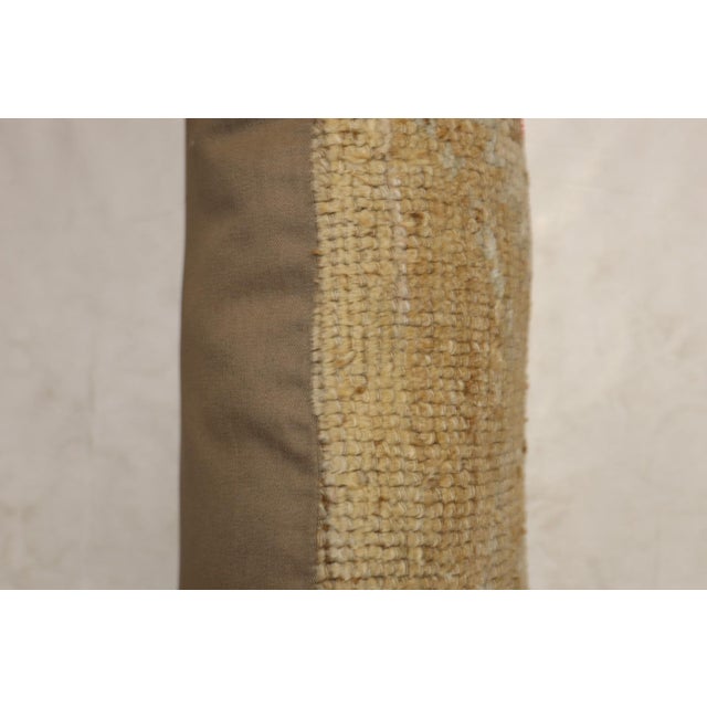 Pillow made from an antique turkish oushak rug