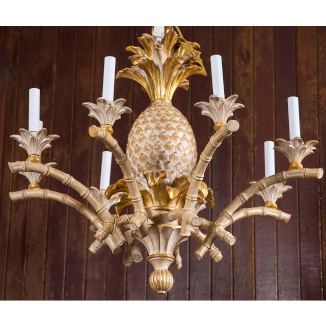 Italian carved solid wood pineapple, faux bamboo chandelier. Never used stock from the 1970s. Eight lights. Beautifully...