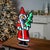 Celebrate the magic of the season with the Santa with Pine Tree Ekkolight. This charming Santa, dressed in festive red and...