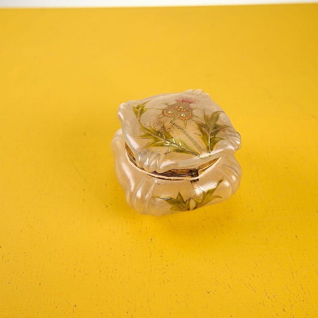 French liberty glass jewelery box with hand-painted floral decorations Height: 6.5 Width: 8.5 Depth: 8.5 This piece is...