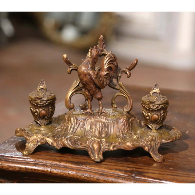 This elegant antique double inkwell brings sculptural character and French symbolism to a desk, library, or study. Crafted...