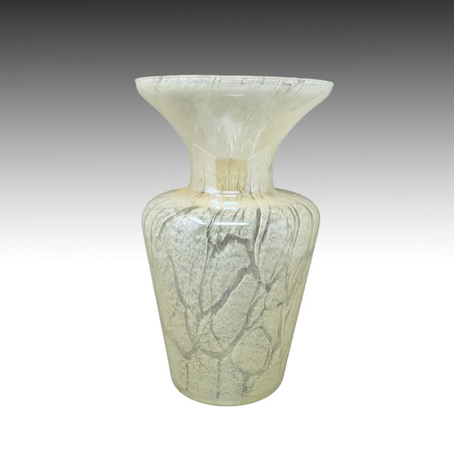 1970s Luxury handcrafted vase in Murano glass in ivory color by Maestro del Vetro. Made in Italy. The piece features a...