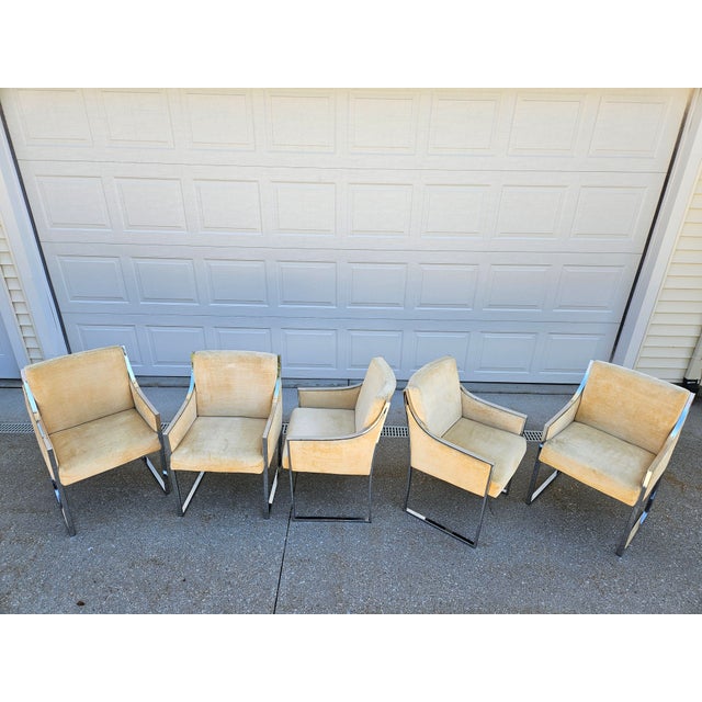 A set of five chrome and yellow crushed velvet upholstered dining armchairs by Comfort Designs and attributed to Adrian...