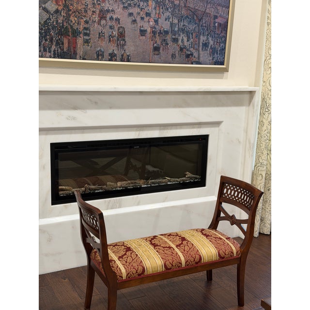 A distinctive vintage Chippendale-style window bench featuring elegant pierced lattice backs, gracefully curved open arms,...