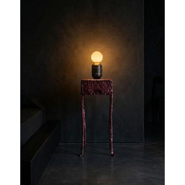 Unique modern accent table entirely hand-forged from solid steel with a deep multi-layered patinated finish. This is not...