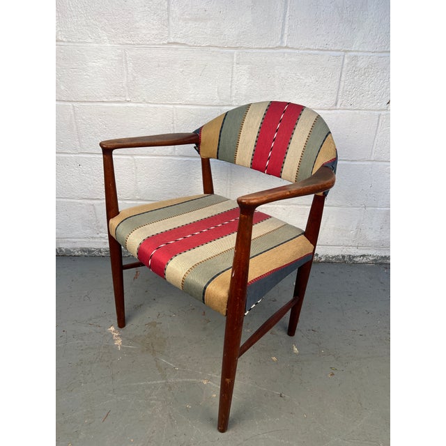 Elegant mid-century modern Danish chair, “Model 223,” Attributed to Kurt Olsen. Crafted in rich walnut with Olsen’s...