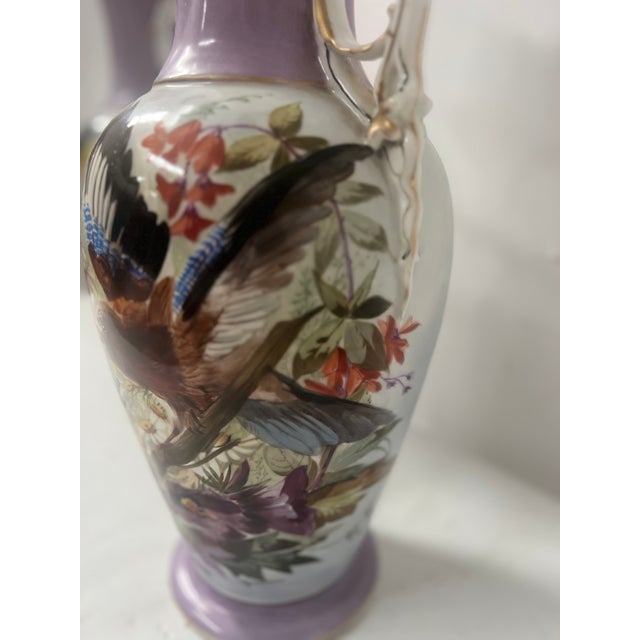 Pair of two-handled porcelain vases Polychrome decoration of birds and flowers Good condition Dimensions H 53 x 23 cm...