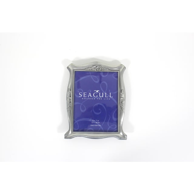 Large, heavy vintage pewter rectangular frame with beautiful flower detail made by Seagull Pewter Canada. Easel back for a...