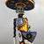 A monumental Huichol (Wixárika) beaded sculpture of La Catrina, executed at an impressive 36-inch scale. The figure is...