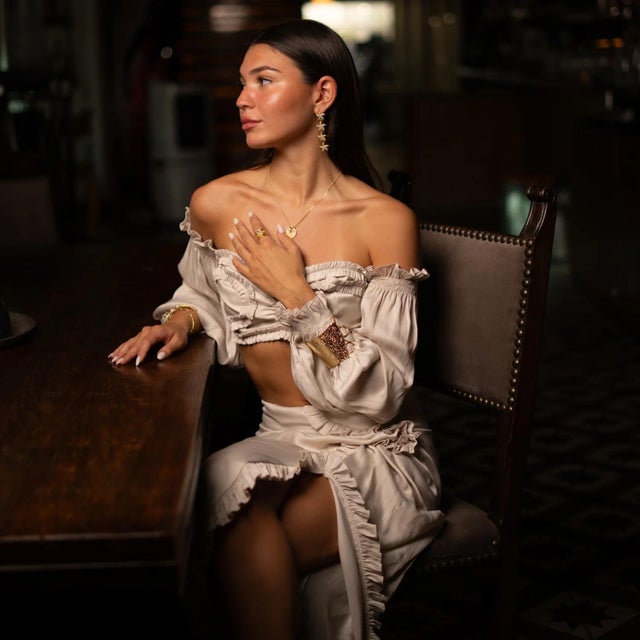 Dive into ocean-inspired elegance with the Turquoise Starfish Cascade Gold Dangle Earrings. Handcrafted from bronze and...