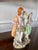 Antique Staffordshire figure of a couple in period dress holding a baby. In original condition, no cracks, chips or...