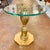 Graceful and glamorous, this vintage pedestal accent table brings together classical form and Hollywood Regency flair. The...