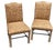 This is a pair of vintage side chairs that are really unique. The frame of each chair is wood and has a beautiful leg...