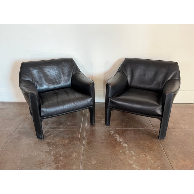 1980s Cassina cab leather lounge chairs in good vintage condition. Some cracks on the leather on both chairs, no rips or...
