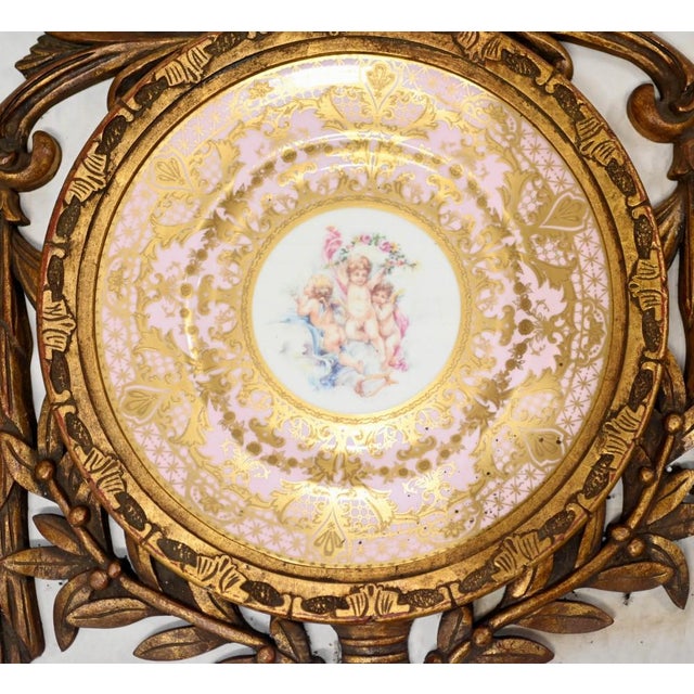 Elegant set of four Sevres style porcelain plaques with cherub panels - Each plaque features a plate with intricate cherub...