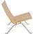 Poul Kjærholm PK22 lounge chair upholstered in original natural leather and with a frame of brushed spring steel. The...