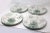 A set of "Hana Green" dinnerware by Farberware, including 4 dinner plates, 1 salad plate, and 2 mugs. Good condition; no...