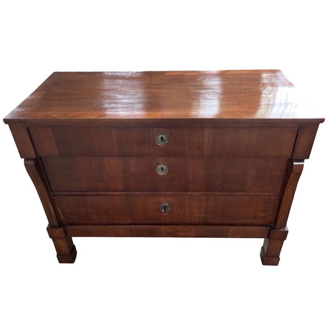 Empire chest of drawers hand-made in Italy in the early 1800s using walnut. The chest of drawer is very simple in lines,...