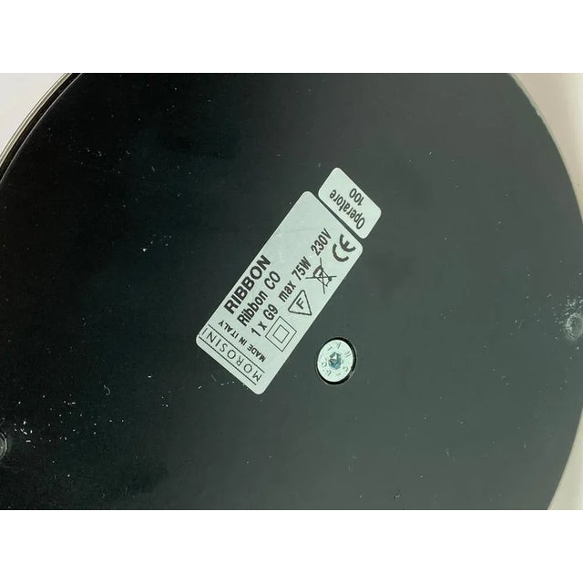 Table lamp, model Ribbon, of Italian design by Morosini from the 1980s. The lamp is with a black shade and frame of metal....