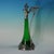 WMF green glass claret jug of stylised form, the mount depicting bathing maidens. The handle and finial modelled as a...