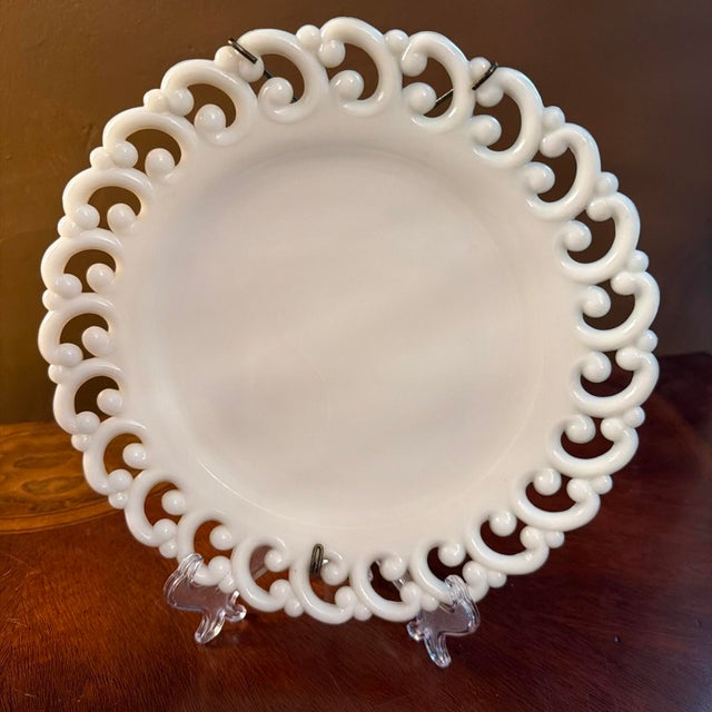 The Vintage Fenton White Milk Glass Reverse C Lace Edge 9” Set of 2 plates with wall hangers is a charming addition to any...