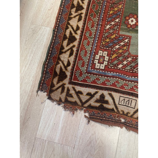 A beautifully preserved handmade Caucasian Borchalu Kazak rug dating to the 1860s, this piece showcases the bold geometry,...