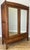 A beautiful Antique French wardrobe crafted from oak, featuring elegant proportions and stunning polished mirrored doors....