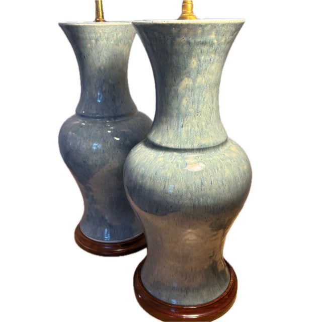 A pair of John Thompson hand crafted drip glaze ceramic table lamps in cerulean. These are the 'Baluster' style vase shape...