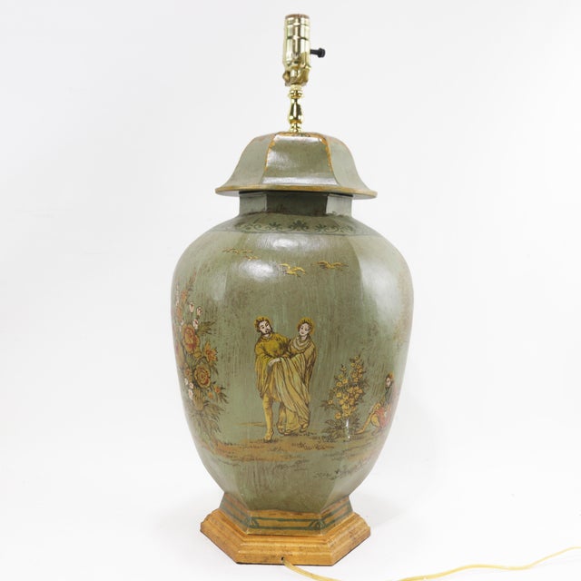 Elevate your interior with this exquisite pair of hand-painted chinoiserie-style tole lamps. Each lamp showcases a...