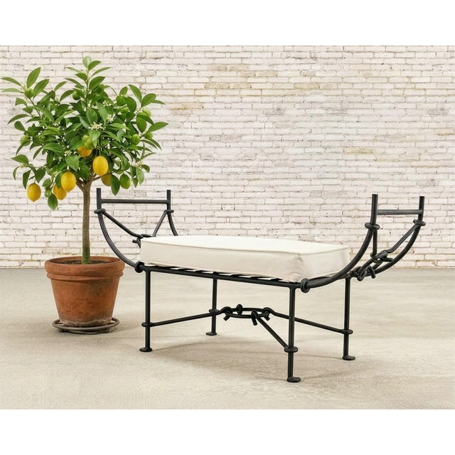 A handsome French wrought aluminum Neoclassical bench crafted in the style of Diego Giacometti. The bench is constructed...