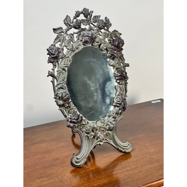 Dating to 1909, this exceptional Art Nouveau vanity mirror beautifully captures the movement’s fascination with flowing...