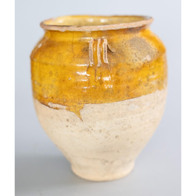 A superb antique 19th century French confit pot with mustard yellow glaze from the South of France, Castelnaudary. This...