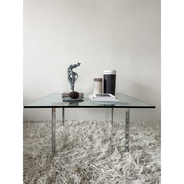 Glass Coffee Table by Mies Van Der Rohe, 1970s, in Good conditions. Designed 1920 to 1949 This piece has an attribution...
