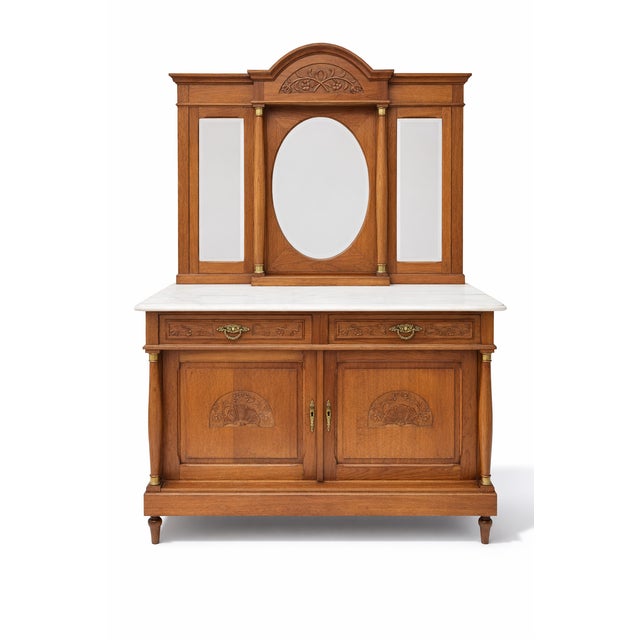 Beautiful French oak marble top dresser with mirror. Wonderful design elements combine columns at the dresser corners and...
